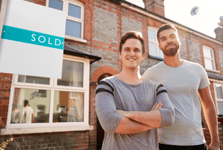 Men in front of sold house shutterstock_1273188067