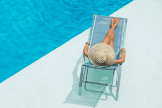 Relaxing next to pool Shutterstock_377350393