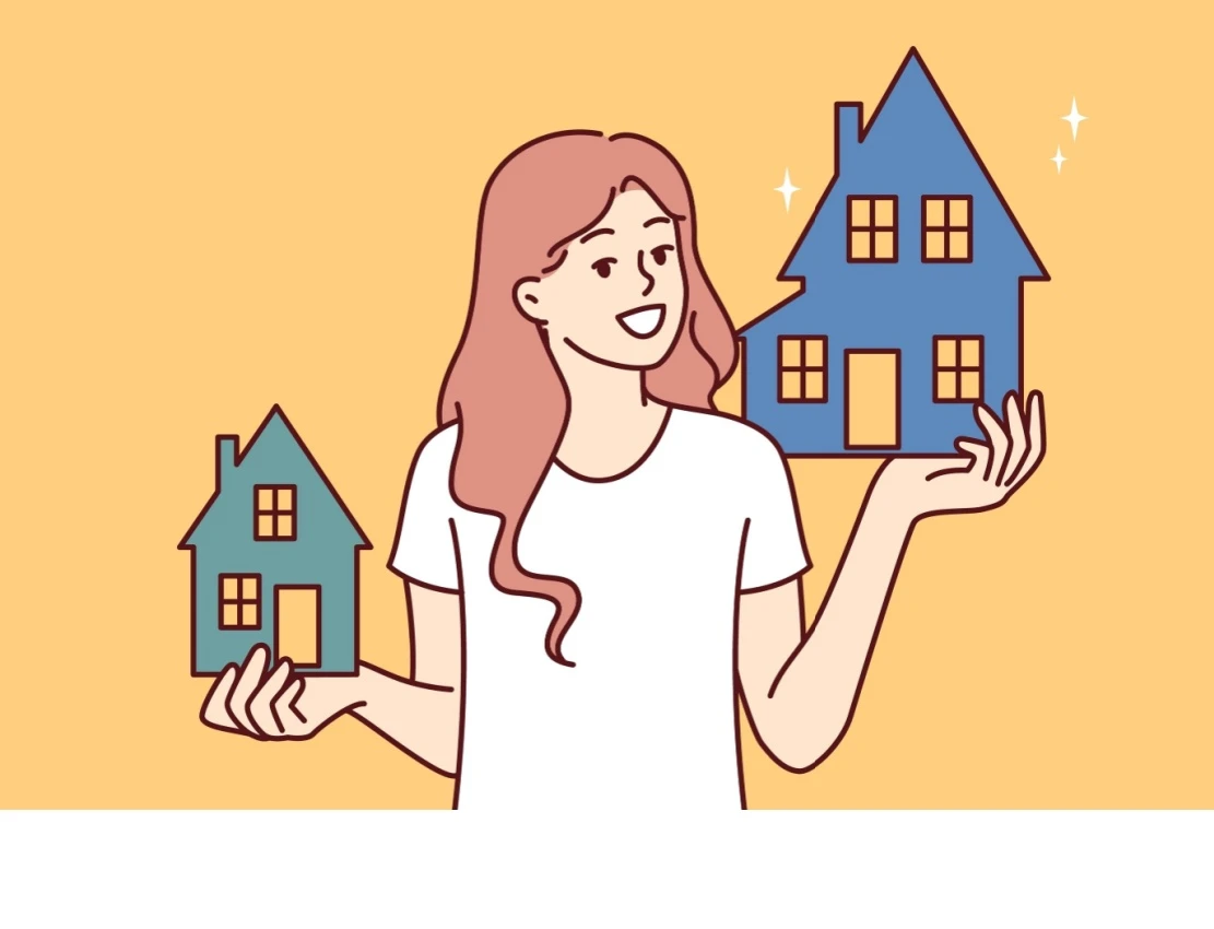 Holding 2 houses Shutterstock_2375685999