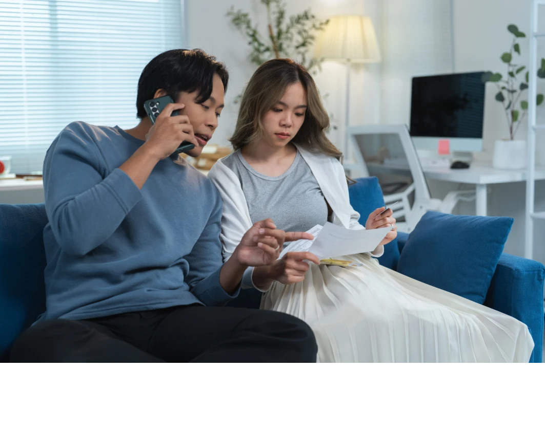 Couple makes phone call Shutterstock_2577111141