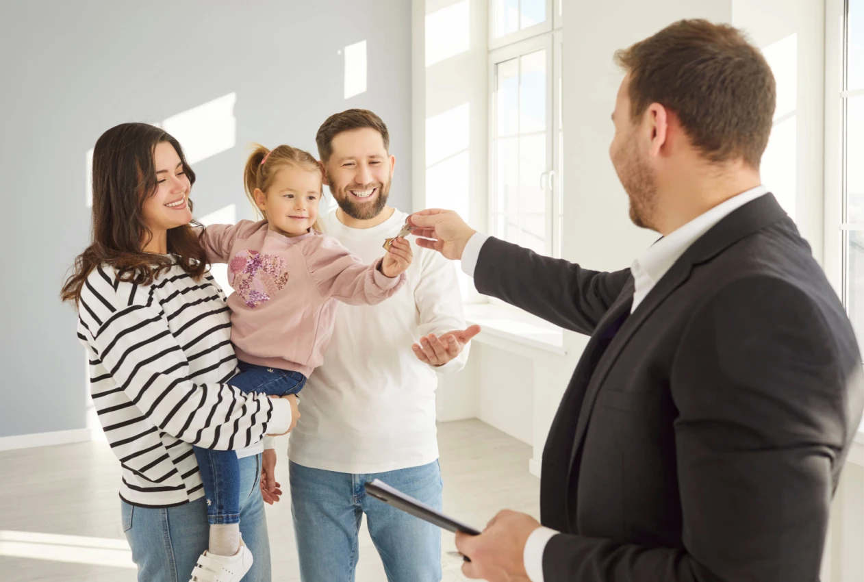 Family getting keys Shutterstock_2622330081