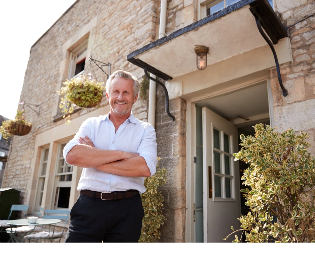 Landlord in front of house Shutterstock_1243294882 (2)