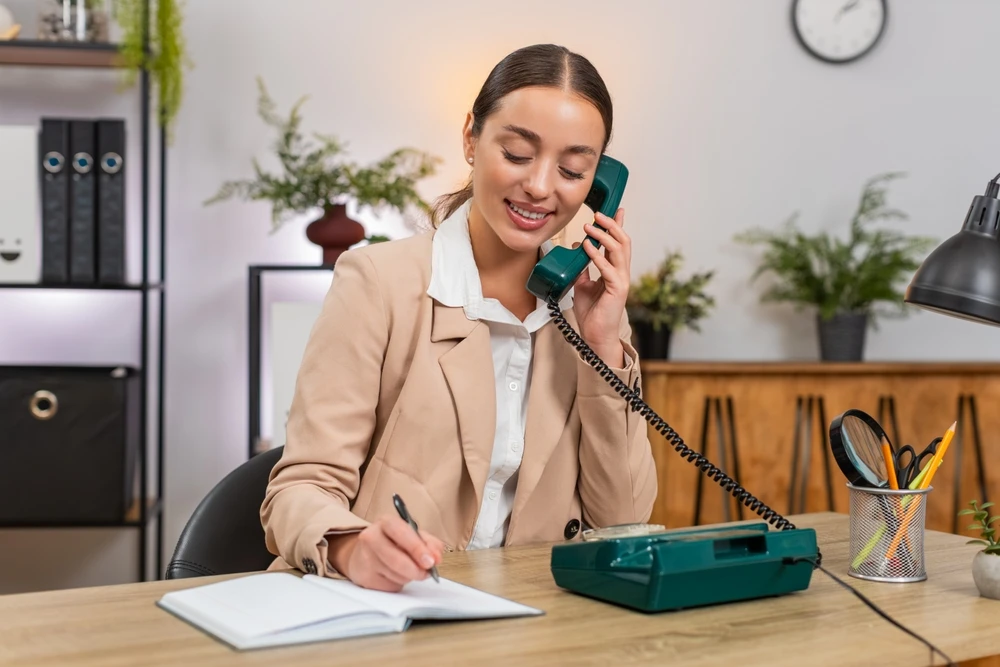 Answering phone shutterstock_2697412579