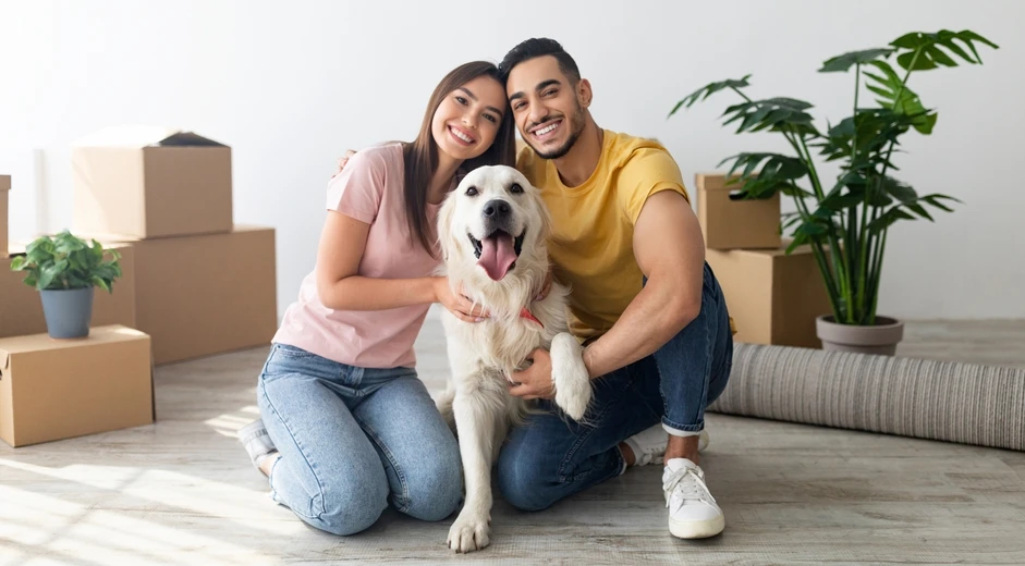 Dog with parents shutterstock_2498359977
