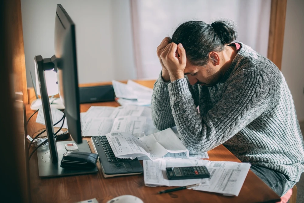Man upset about bills shutterstock_2218478985 (1)